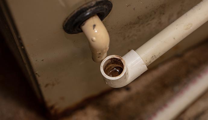 Close-up view of ac unit drain overflow